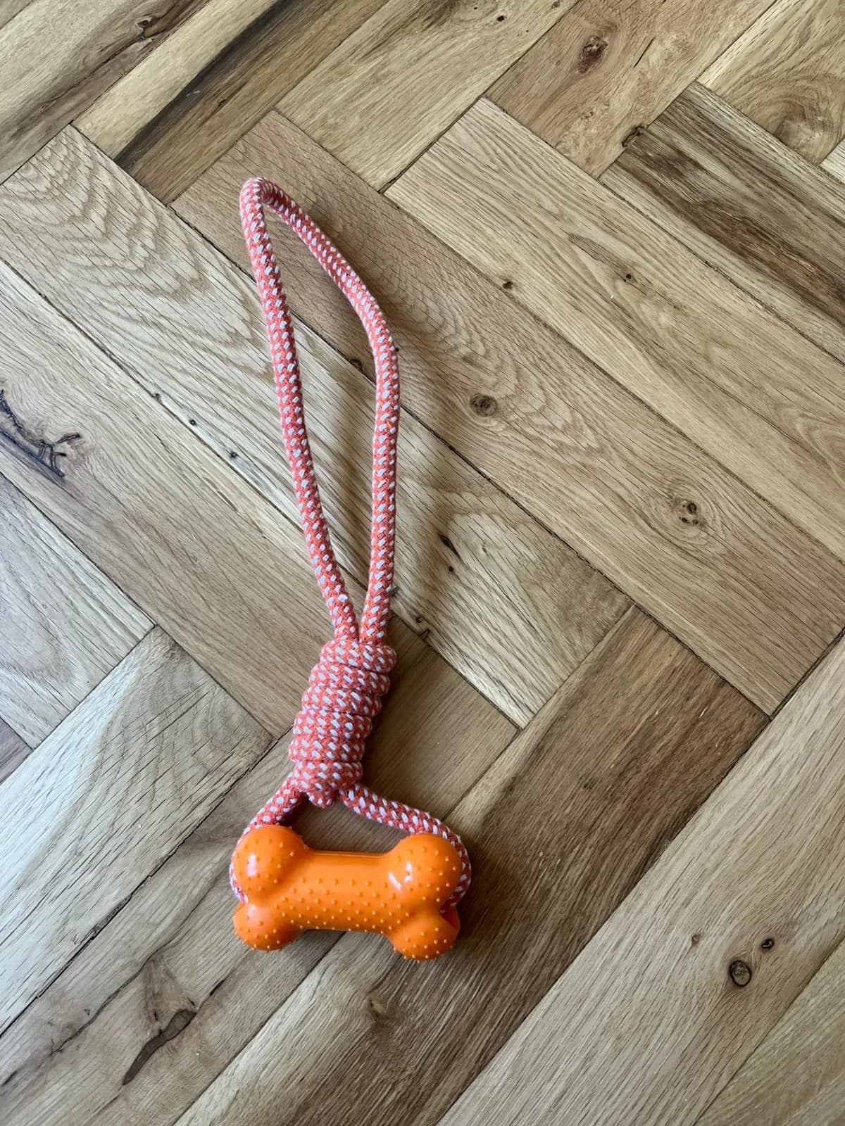 Přetahovadlo pro psy s gumovou kostí a pevným lanem, 31 cm, oranžové
